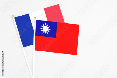 Taiwan and France stick flags on white background. High quality fabric, miniature national flag. Peaceful global concept.White floor for copy space. Free Download Taiwan and France stick flags on white background. High quality fabric, miniature national flag. Peaceful global concept.White floor for copy space. - GFXLoad