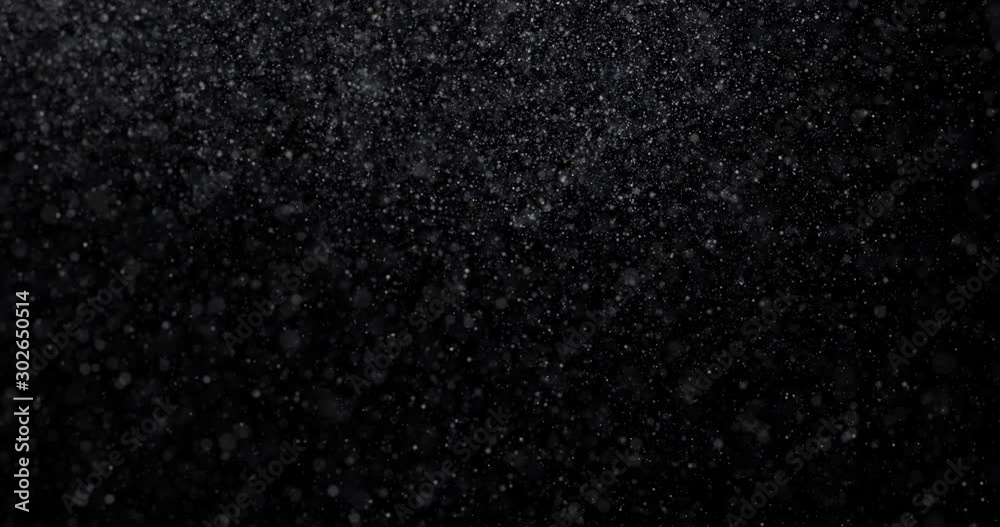 Natural white winter snowfall on a black background Natural white winter snowfall on a black background
