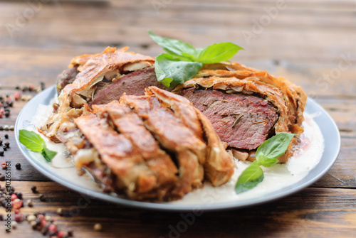 beef tenderloin festive dish. baked meat in dough