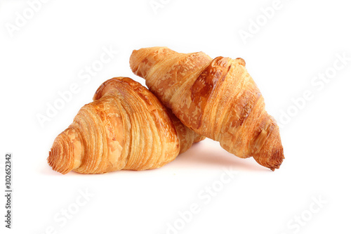 Foto Two french croissant  isolated on white background