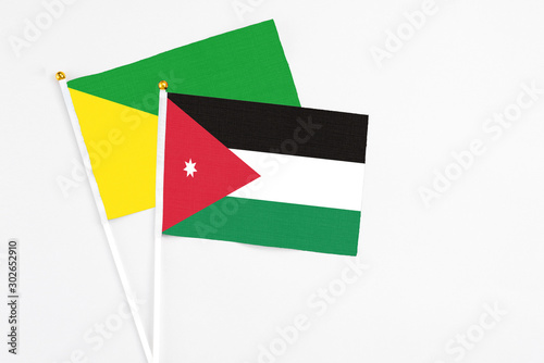 Free Download Jordan and French Guiana stick flags on white background. High quality fabric, miniature national flag. Peaceful global concept.White floor for copy space. - GFXLoad