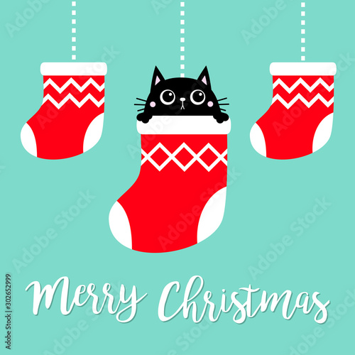 Merry Christmas. Hanging christmas red socks dash line. Black cat head face head. Cute cartoon kawaii baby character. Flat design. Blue background.