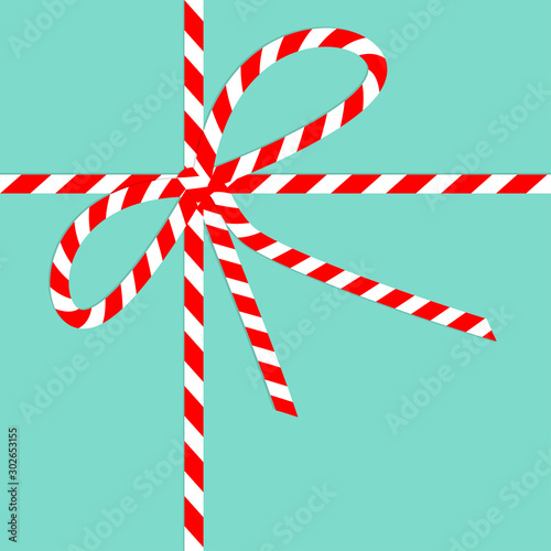 Red White ribbon bow knot on blue background. Merry Christmas. Candy cane striped color. Cute xmas holiday decoration. Flat design. Isolated.