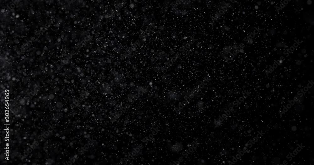 Natural white winter snowfall on a black background Natural white winter snowfall on a black background