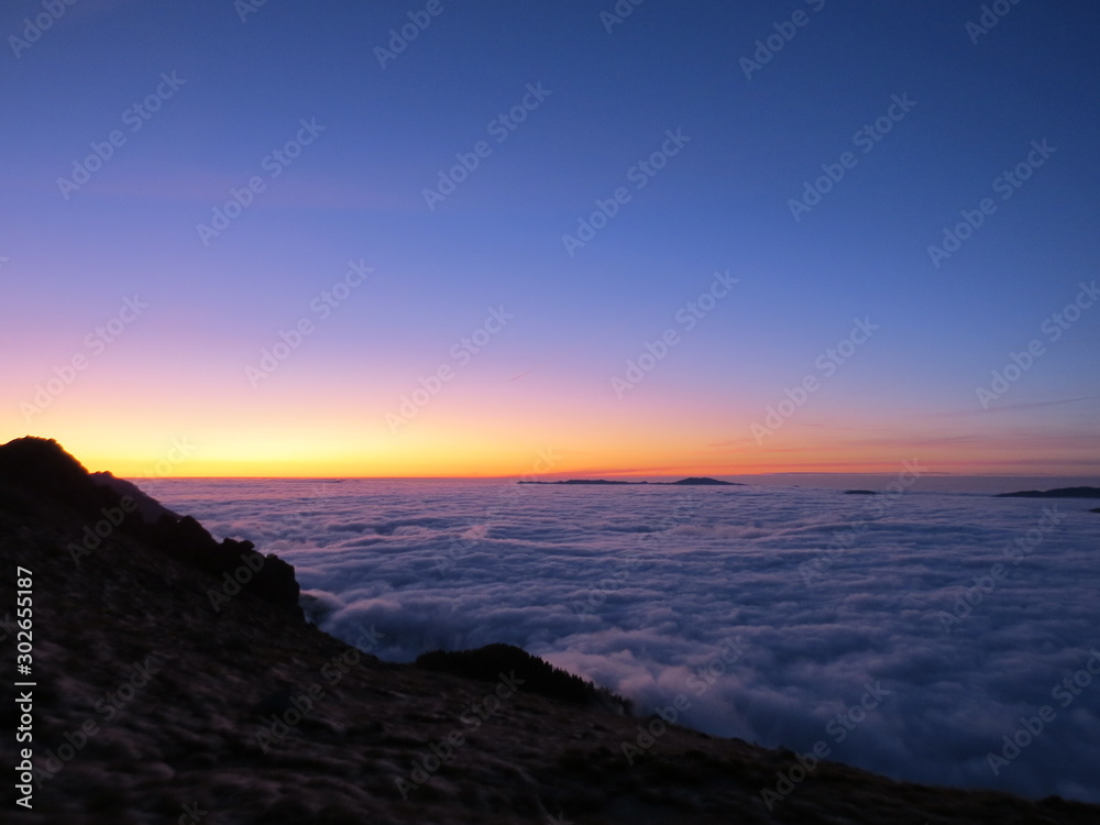 Sunrise on the clouds in mountain