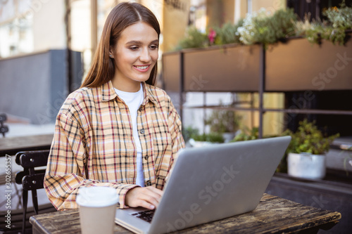 Cheerful woman spending her day at work