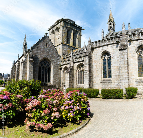 view of the historic and picturesque church of Saint Ronan in Locronan in Brittany photo