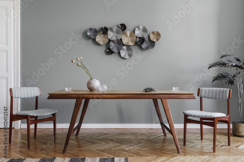 Photos Modern and stylish dining room interior with glamour wooden table , elegant chairs and design decoration