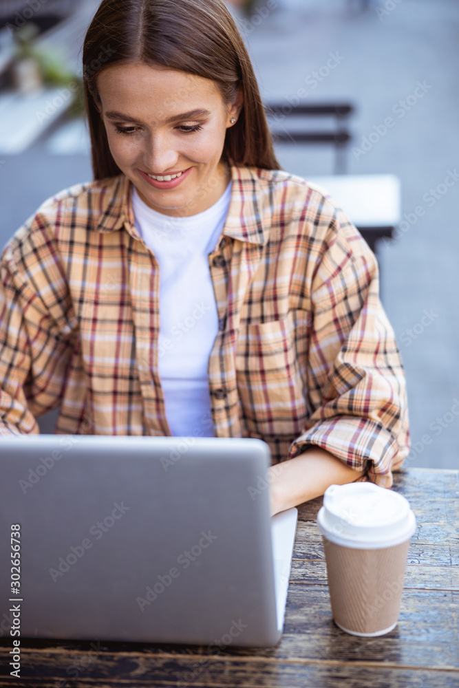 Fototapeta premium Woman in process of writing new article
