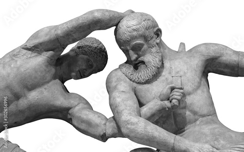 Antique statue of warrior killing beard amn by sword. ancient sculpture of gladiators photo