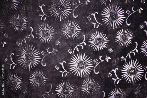 Floral pattern on a black fabric area