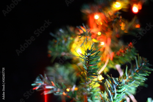 Artificial Christmas tree decorated with lights