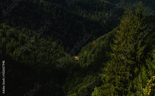 Scenic aerial view of isolated house in the woods  Carpathian mountains  Romania