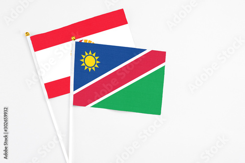 Free Download Namibia and French Polynesia stick flags on white background. High quality fabric, miniature national flag. Peaceful global concept.White floor for copy space. - GFXLoad