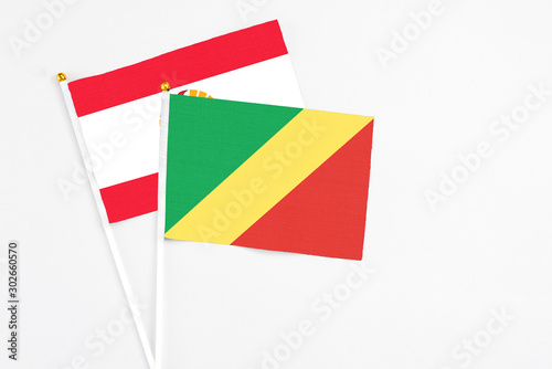 Free Download Republic Of The Congo and French Polynesia stick flags on white background. High quality fabric, miniature national flag. Peaceful global concept.White floor for copy space. - GFXLoad