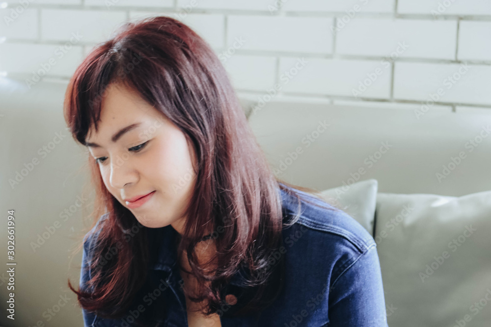 Young pretty Asian woman sitting in the cafe with nature light. Young pretty Asian woman sitting in the cafe with nature light.