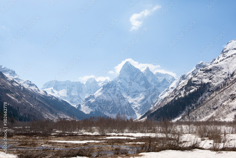 Caucasus mountains covered with snow in spring,