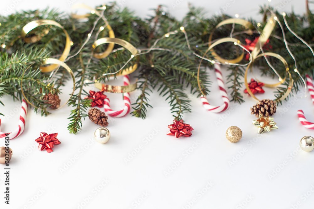 ...Christmas decorative background with pine branches,candy and christmas ball on the white background. Christmas Holiday Concept. copy space..