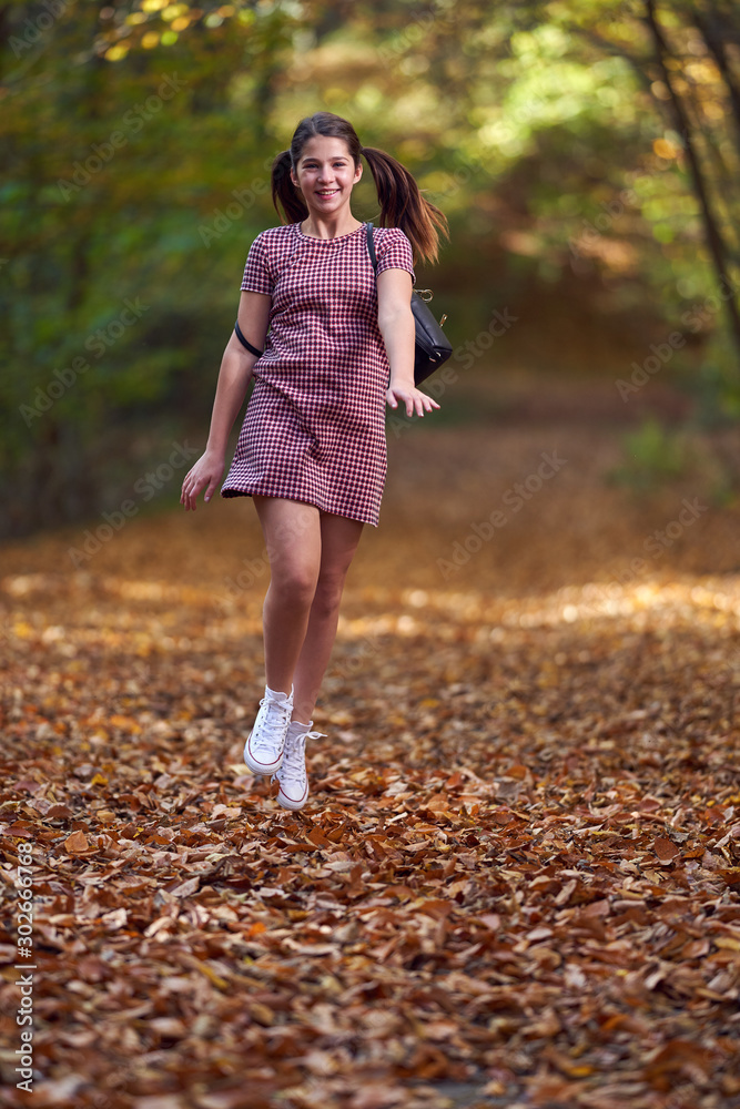Schoolgirl walking in the forest Schoolgirl walking in the forest