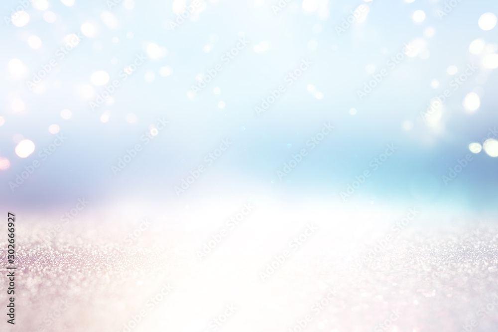 Fototapeta premium abstract glitter silver, gold and blue lights background. de-focused