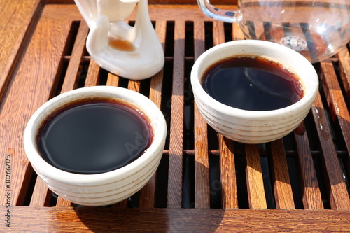 Chinese tea ceremony using tea utensils in nature.