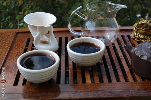 Chinese tea ceremony using tea utensils in nature.