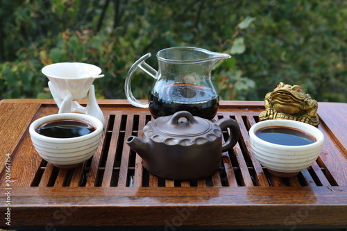 Chinese tea ceremony using tea utensils in nature.