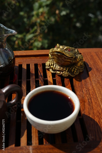 Chinese tea ceremony using tea utensils in nature.