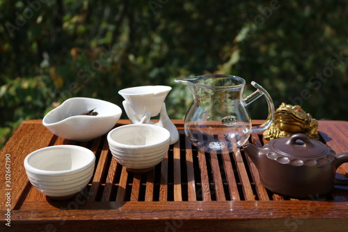 Chinese tea ceremony using tea utensils in nature.