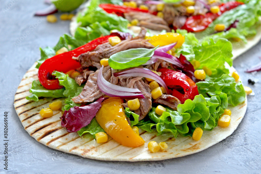 Tortillas flat various vegetables and beef for tacos or burrito on stone background. Top view with copy space. Tortillas flat various vegetables and beef for tacos or burrito on stone background. Top view with copy space.