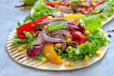 Tortillas flat various vegetables and beef for tacos or burrito on stone background. Top view with copy space.