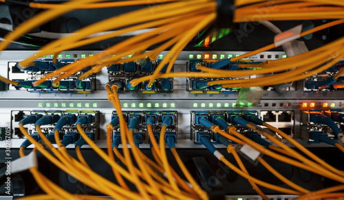 Close up view of internet equipment and cables in the server room photo