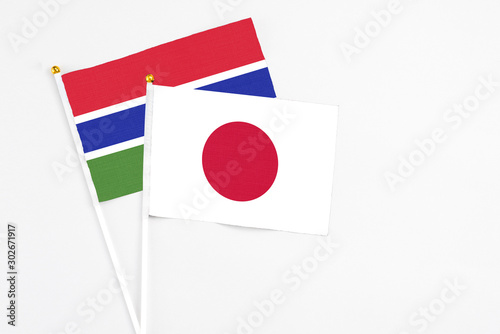 Japan and Georgia stick flags on white background. High quality fabric, miniature national flag. Peaceful global concept.White floor for copy space. Free Download Japan and Georgia stick flags on white background. High quality fabric, miniature national flag. Peaceful global concept.White floor for copy space. - GFXLoad