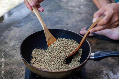 Traditional roasting coffee at home,  freshly roasted coffee beans.