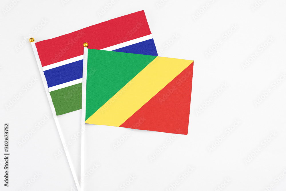 Republic Of The Congo and Georgia stick flags on white background. High quality fabric, miniature national flag. Peaceful global concept.White floor for copy space. Republic Of The Congo and Georgia stick flags on white background. High quality fabric, miniature national flag. Peaceful global concept.White floor for copy space.