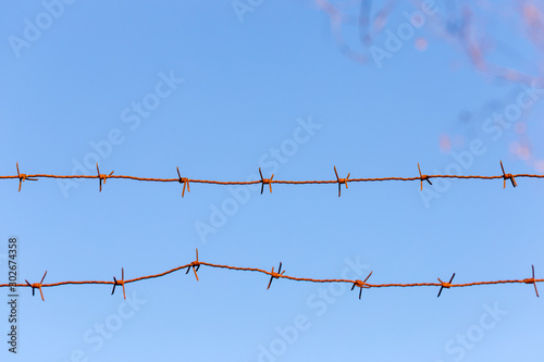 Barbed wire fence. Let. Prison. Spikes. Block. Prisoner. Holocaust Concentration camp. Prisoners. Depressive background.