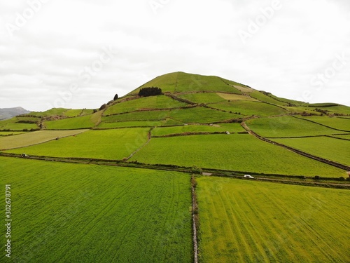Green hill in the Azores fields