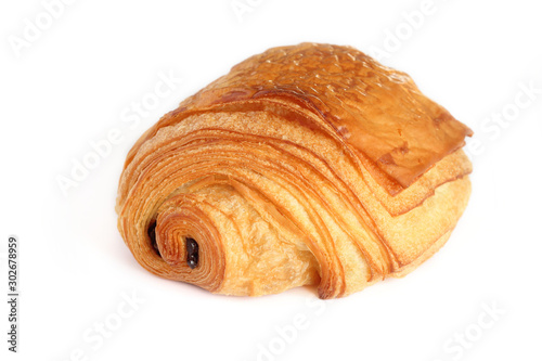 French traditional chocolate croissant with two piece of  dark chocolate inside  - petit pain au chocolat isolated on white background. photo