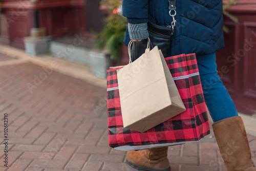 woman carrying shopping bags at Christmas