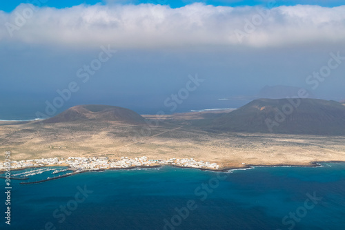 View from Lanzarote over the Atlantic with La Graciosa Island covered in calima