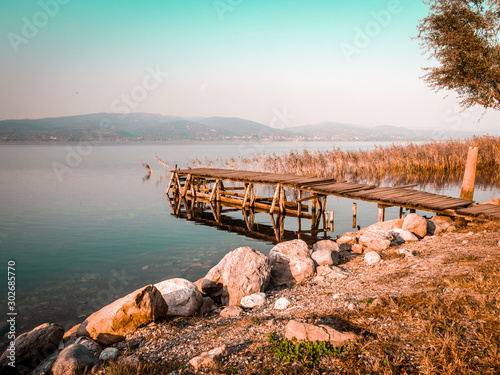 wooden small pier over the lake photo