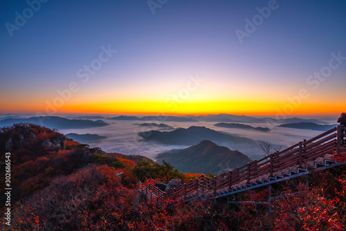 Photography The horizon line is normally covered with morning mist in autumn on the peak of Chunmasan Mountain in Seoul, South Korea
