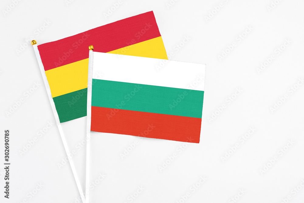 Bulgaria and Ghana stick flags on white background. High quality fabric, miniature national flag. Peaceful global concept.White floor for copy space. Bulgaria and Ghana stick flags on white background. High quality fabric, miniature national flag. Peaceful global concept.White floor for copy space.