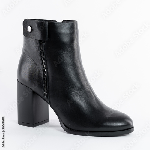 Women's autumn ankle boots black zip average heels, one pair of isolated white background