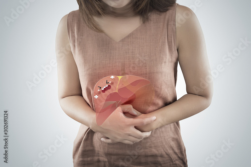 The cartoon of liver is on the woman body against a gray background, Liver disease or Hepatitis, Concept with body problem and Female anatomy