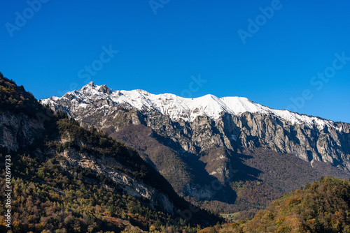 Snow capped mountains in the Giudicarie Alps seen from the Lake Tenno, Trento province, Trentino-Alto Adige, Italy, Europe