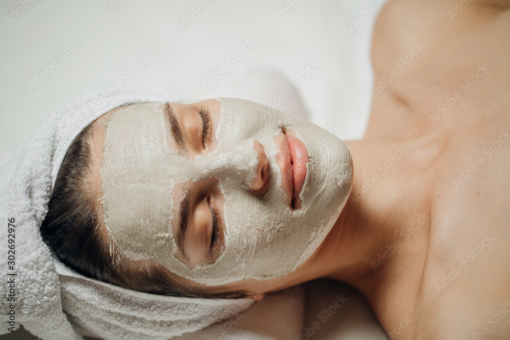 Naklejka premium Beautiful Woman with a Facial Mask
