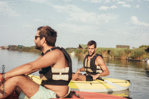 Two Men Kayaking © LStockStudio