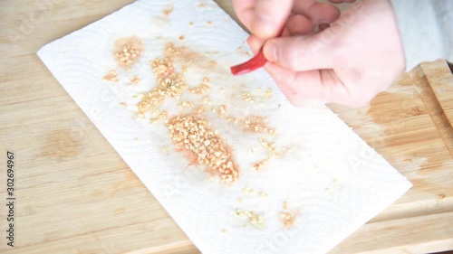 Squeeze Seeds from Pepper to Dry on Paper Towl 24fps photo