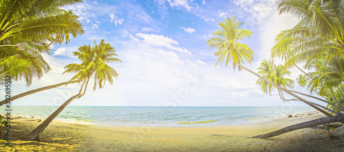Fototapeta Naklejka Na Ścianę i Meble -  Panorama summer on the beach in Thailand.blue sky and white clouds. Freshness of the new day. Bright blue background. Relaxing feeling like being in the sky.Coconut trees on the beach.